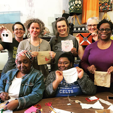 At one of public sewing sessions hosted by Bib & Tucker Sew-Op the University of Alabama at Birmingham’s (UAB) Department of Art & Art History, participants show off the blocks they made to commemorate Loving Day. Photo from the UAB website.