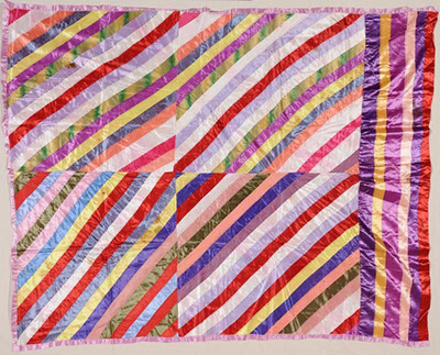 Funeral quilts became very popular after World War II. Women would sew together the ribbons from funeral bouquets to create a quilt for the bereaved ‘s family. After her husband passed away, Omie Whittie Howard Kelly took all of the ribbons from the floral arrangements, pressed them, and sewed them together to make a quilt honoring her husband’s memory. Text and image courtesy of the North Carolina Museum of History.