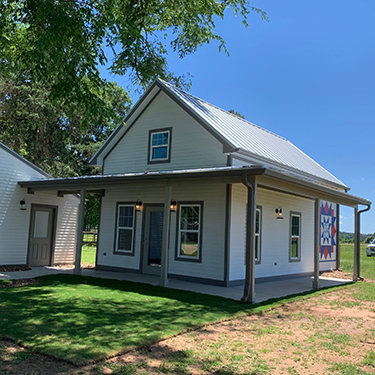 Proceeds from the quilt show have been used to build a new building exclusively for St. Vincent de Paul charity work. In tribute, a quilt square is painted on the side of the building.